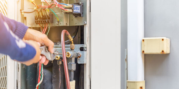 Selective Focus Of Air Conditioning Repair, Repairman On The Flo