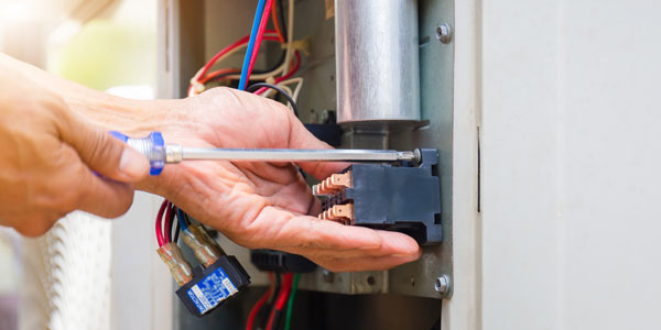 Close Up Of Air Conditioning Repair, Repairman Installing Magnet